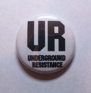 UNDERGROUND RESISTANCE Metal Badge "UR" logo WHITE  (UNDERGROUND RESISTANCE)
