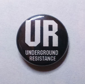 UNDERGROUND RESISTANCE Metal Badge "UR" logo BLACK  (UNDERGROUND RESISTANCE)